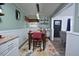 Charming dining area with wood table and colorful rug, creating a warm and inviting space for meals at 114 Short E St, Hillsborough, NC 27278
