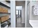 Charming butler's pantry with open shelving offers convenient storage and organization, enhancing the home's functionality at 114 Short E St, Hillsborough, NC 27278