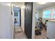 Hallway featuring rustic sliding barn doors leads to exercise room, adding character and functionality to the home at 114 Short E St, Hillsborough, NC 27278