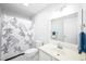 Bright bathroom with a patterned shower curtain, adding a touch of elegance to this essential space at 1149 Highway Nc 87, Pittsboro, NC 27312