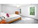 Spacious bedroom with natural light from two windows and simple decor at 1149 Highway Nc 87, Pittsboro, NC 27312