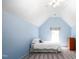 Angled ceiling and cozy decor create a tranquil retreat in this inviting bedroom, perfect for relaxation at 1149 Highway Nc 87, Pittsboro, NC 27312