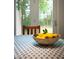 Bright dining area featuring a bowl of lemons on a table with a view to the outdoors at 1149 Highway Nc 87, Pittsboro, NC 27312