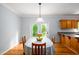 Charming dining area with an inviting table, view to kitchen and outdoor access through French doors at 1149 Highway Nc 87, Pittsboro, NC 27312