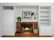 Cozy brick fireplace with built-in shelving, perfect for creating a warm ambiance at 1149 Highway Nc 87, Pittsboro, NC 27312
