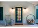 Comfortable rocking chair and firewood on a quaint covered front porch at 1149 Highway Nc 87, Pittsboro, NC 27312