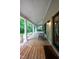 Spacious covered front porch with rocking chair and porch swing at 1149 Highway Nc 87, Pittsboro, NC 27312