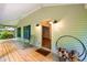 Covered front porch with rocking chair and view of the yard at 1149 Highway Nc 87, Pittsboro, NC 27312