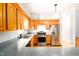 Bright kitchen with wood cabinets, gray countertops and stainless steel appliances at 1149 Highway Nc 87, Pittsboro, NC 27312