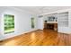 Bright living room with hardwood floors and a brick fireplace at 1149 Highway Nc 87, Pittsboro, NC 27312