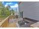 Outdoor deck featuring comfortable furniture and a barbecue, ideal for entertainment at 115 Parkers Gate Dr, Youngsville, NC 27596