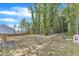 Expansive back yard surrounded by mature trees and privacy fence, offering a serene outdoor space at 115 Parkers Gate Dr, Youngsville, NC 27596
