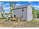 This backyard offers a beautiful outdoor living space on a sunny day at 115 Parkers Gate Dr, Youngsville, NC 27596