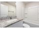 Bathroom featuring granite countertop and a shower-tub combo at 115 Parkers Gate Dr, Youngsville, NC 27596