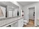 Bright bathroom with modern vanity, granite countertop, walk-in shower, and tile floors at 115 Parkers Gate Dr, Youngsville, NC 27596