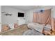 Vibrant bedroom with whimsical decor, plush carpet, comfortable seating, and a flat screen television at 115 Parkers Gate Dr, Youngsville, NC 27596