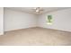 Spacious bedroom with plush carpeting, neutral walls, and a window providing natural light at 115 Parkers Gate Dr, Youngsville, NC 27596