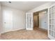 Bedroom featuring glass paneled French doors and carpeted floors at 115 Parkers Gate Dr, Youngsville, NC 27596