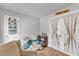 Playful bedroom featuring french doors, gray walls, neutral carpet, and comfortable seating at 115 Parkers Gate Dr, Youngsville, NC 27596