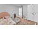 Charming bedroom with carpet flooring, neutral walls, and a comfortable round ottoman at 115 Parkers Gate Dr, Youngsville, NC 27596
