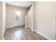 Inviting entryway features wood-look flooring, neutral walls, and a staircase for a modern aesthetic at 115 Parkers Gate Dr, Youngsville, NC 27596