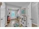 Open foyer with wood floors, white doors, neutral paint and an area set up as a play space at 115 Parkers Gate Dr, Youngsville, NC 27596