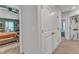 Hallway leading to a bedroom with green walls with a view of closets and other rooms at 115 Parkers Gate Dr, Youngsville, NC 27596