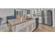 Kitchen island featuring stainless steel appliances, granite counters and storage at 115 Parkers Gate Dr, Youngsville, NC 27596