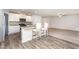 Stylish kitchen with granite countertops, white cabinetry, and stainless steel appliances at 115 Parkers Gate Dr, Youngsville, NC 27596