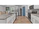 Modern kitchen with granite counters, stainless appliances and breakfast bar at 115 Parkers Gate Dr, Youngsville, NC 27596