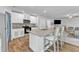 Updated kitchen with granite counters, breakfast bar, and modern white cabinetry at 115 Parkers Gate Dr, Youngsville, NC 27596