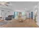 Open living area featuring hardwood floors, sliding glass doors and white kitchen at 115 Parkers Gate Dr, Youngsville, NC 27596