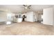 Large living room flows into the kitchen with a breakfast bar and modern appliances at 115 Parkers Gate Dr, Youngsville, NC 27596