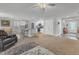 Open-concept living room and kitchen featuring hardwood floors and modern fixtures at 115 Parkers Gate Dr, Youngsville, NC 27596