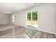 Spacious living room featuring sliding glass doors with access to an outdoor deck at 115 Parkers Gate Dr, Youngsville, NC 27596