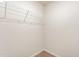 Walk-in closet with a wire shelf above the carpeted floor at 115 Parkers Gate Dr, Youngsville, NC 27596