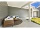 Covered patio area with comfortable seating, creating an ideal outdoor living space at 1211 Brown Velvet Ln, Apex, NC 27523