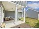 Covered patio area with comfortable seating, creating an ideal outdoor living space at 1211 Brown Velvet Ln, Apex, NC 27523