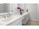 Bathroom with dual sinks, white countertops, and modern fixtures at 1211 Brown Velvet Ln, Apex, NC 27523