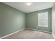 Calming green bedroom featuring neutral walls and a bright window, creating a peaceful retreat at 1211 Brown Velvet Ln, Apex, NC 27523