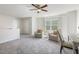 Light-filled bonus room with comfortable seating and workspace, great for entertaining or hobbies at 1211 Brown Velvet Ln, Apex, NC 27523