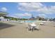 Large community pool surrounded by lounge chairs, tables, and a clubhouse at 1211 Brown Velvet Ln, Apex, NC 27523