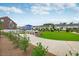 Outdoor grilling area with a playground, seating, and well-maintained landscaping at 1211 Brown Velvet Ln, Apex, NC 27523