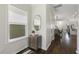 Hallway featuring wood floors, a window, and decorative cabinet at 1211 Brown Velvet Ln, Apex, NC 27523