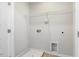 Utility room area with hook ups and shelving unit at 1211 Brown Velvet Ln, Apex, NC 27523