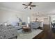 Bright living room showcasing modern decor, hardwood floors, and a stylish area rug at 1211 Brown Velvet Ln, Apex, NC 27523