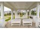 Covered outdoor lounge with comfortable seating and a fireplace, perfect for relaxing at 1211 Brown Velvet Ln, Apex, NC 27523