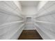Large walk-in closet with wood floors, and wall-to-wall shelving at 1211 Brown Velvet Ln, Apex, NC 27523