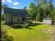 This property features a large backyard, patio, and shed at 128 Madison Ct, Siler City, NC 27344