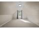 Bonus room featuring plush carpet, neutral walls, window with curtains, and natural light at 128 Madison Ct, Siler City, NC 27344